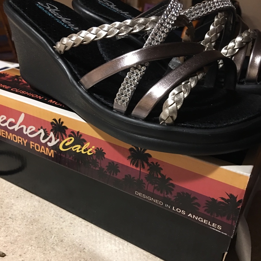 Brand new Skecher sandals. Never worn. Size 8.